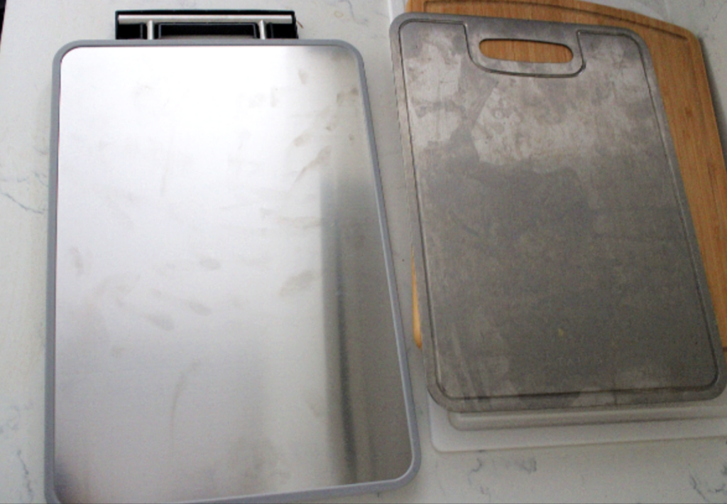 titanium cutting board Left is cheap titanium double sided cutting board and right is 100% pure grade 1 titanium cutting board